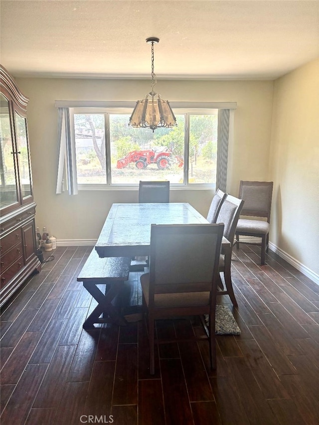 5829 Aurora Ave, Jurupa Valley, CA 91752 - dining area featuring dark wood-style flooring, plenty of natural light, and baseboards