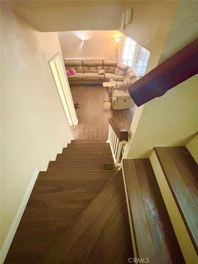 5829 Aurora Ave, Jurupa Valley, CA 91752 - stairway featuring wood finished floors and baseboards