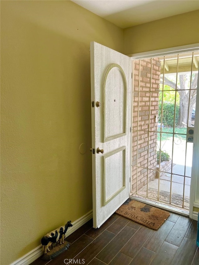 5829 Aurora Ave, Jurupa Valley, CA 91752 - doorway to outside featuring dark wood-style floors and baseboards