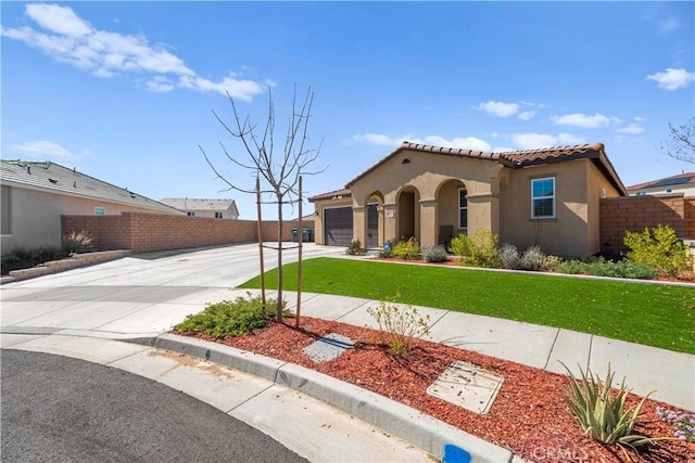 mediterranean / spanish-style house with fence, a tiled roof, an attached garage, stucco siding, and driveway