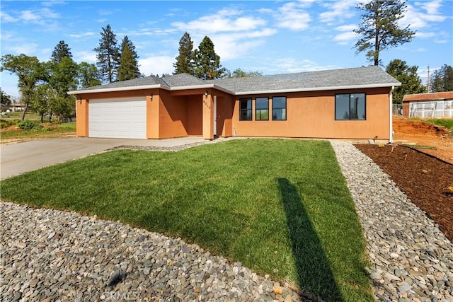 6010 Sunny Ln, Paradise, CA 95969 - ranch-style home featuring stucco siding, a garage, concrete driveway, and a front lawn