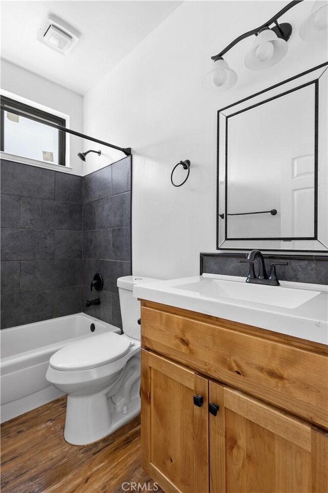 6010 Sunny Ln, Paradise, CA 95969 - bathroom with wood finished floors, toilet, bathing tub / shower combination, and vanity