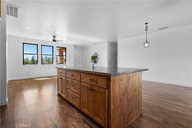 6010 Sunny Ln, Paradise, CA 95969 - kitchen with dark wood-type flooring, a kitchen island, open floor plan, and recessed lighting