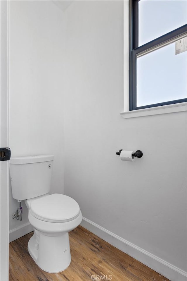 6010 Sunny Ln, Paradise, CA 95969 - bathroom featuring baseboards, wood finished floors, and toilet