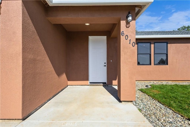 6010 Sunny Ln, Paradise, CA 95969 - property entrance with a patio and stucco siding