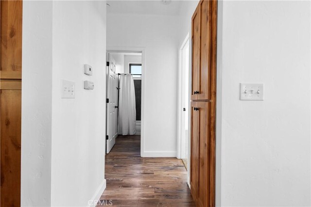 6010 Sunny Ln, Paradise, CA 95969 - hall featuring dark wood-style flooring and baseboards