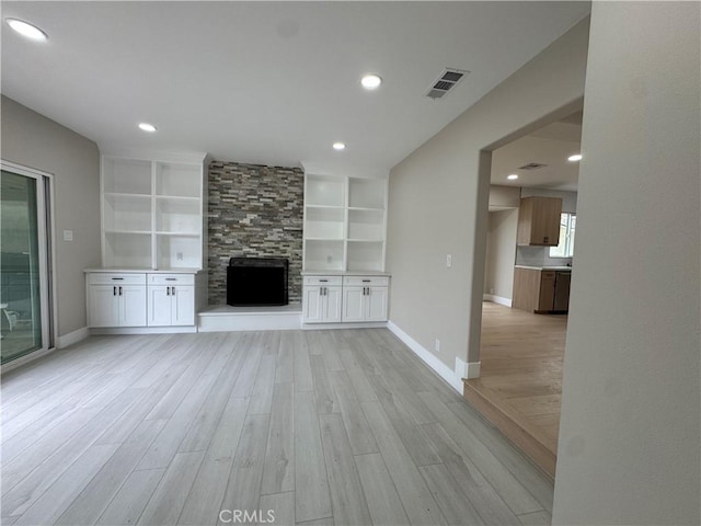 4609 Highgrove Ave, Torrance, CA 90505 - unfurnished living room with light wood-type flooring, a large fireplace, baseboards, recessed lighting, and built in features