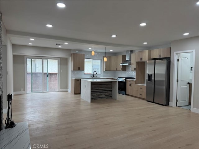 4609 Highgrove Ave, Torrance, CA 90505 - kitchen with stainless steel appliances, wall chimney range hood, light countertops, light wood-type flooring, and recessed lighting