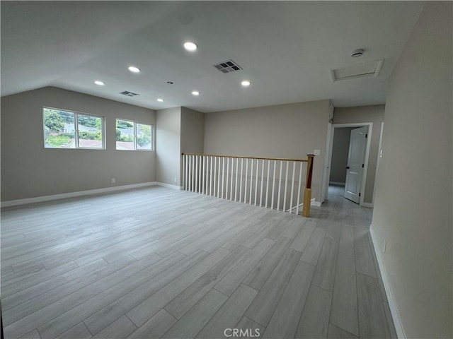 4609 Highgrove Ave, Torrance, CA 90505 - spare room with attic access, light wood finished floors, baseboards, recessed lighting, and lofted ceiling