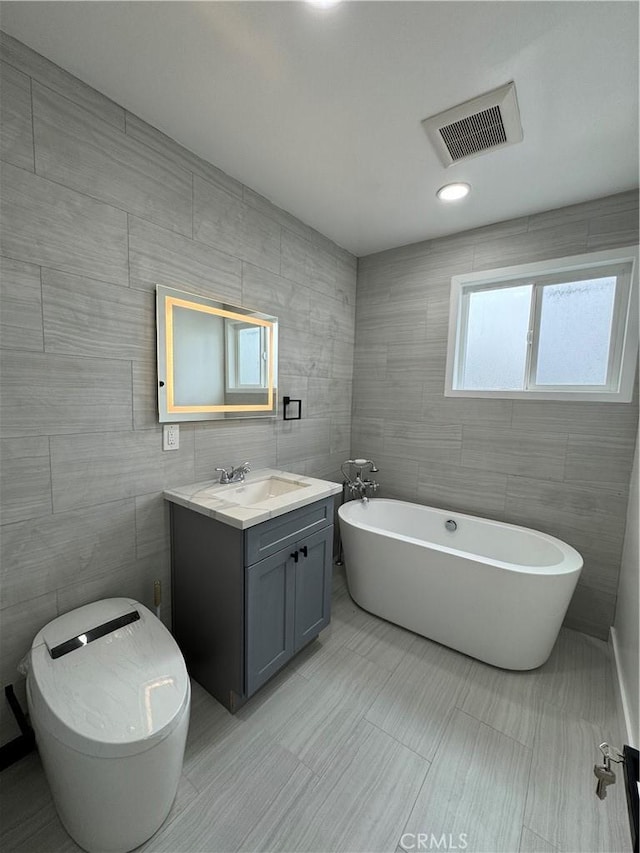 4609 Highgrove Ave, Torrance, CA 90505 - full bath with tile walls, vanity, and a freestanding bath