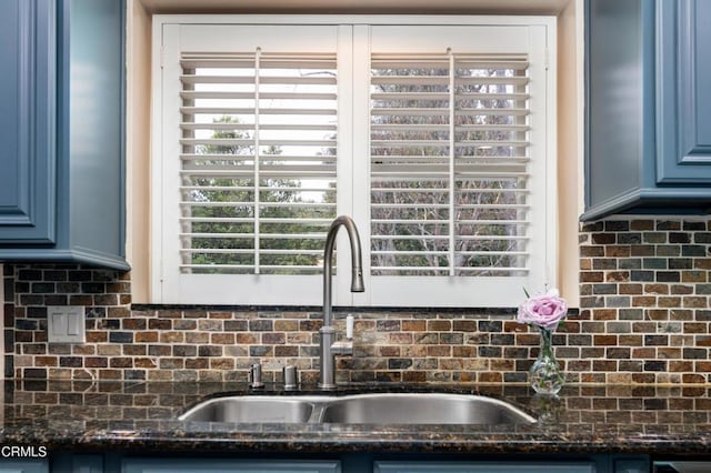 4402 El Camino Corto Ln, Canada Flintridge, CA 91011 - kitchen view of a sink, blue cabinets, backsplash, and dark stone countertops
