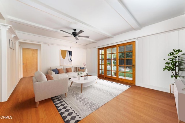 4402 El Camino Corto Ln, Canada Flintridge, CA 91011 - living area with wood finished floors, beam ceiling, a decorative wall, and ceiling fan