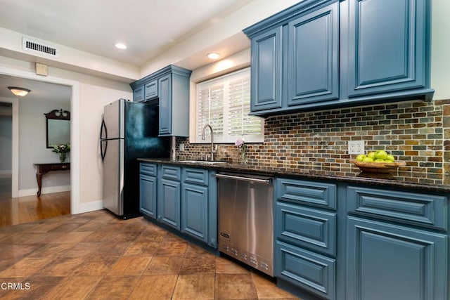 4402 El Camino Corto Ln, Canada Flintridge, CA 91011 - kitchen featuring stainless steel appliances, blue cabinetry, a sink, tasteful backsplash, and recessed lighting