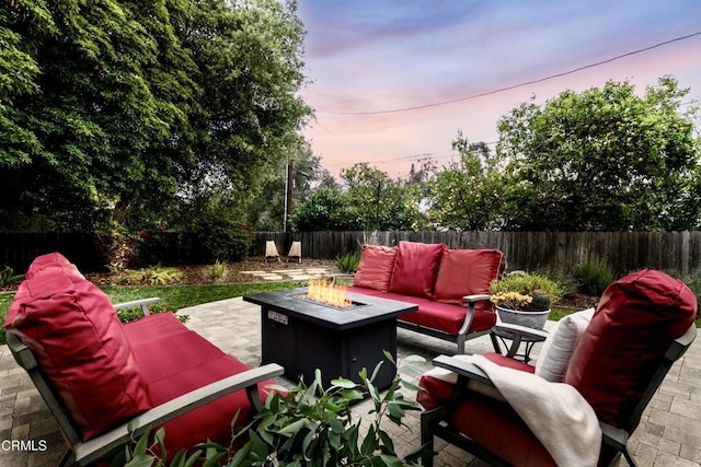 4402 El Camino Corto Ln, Canada Flintridge, CA 91011 - patio terrace at dusk with an outdoor living space with a fire pit and a fenced backyard