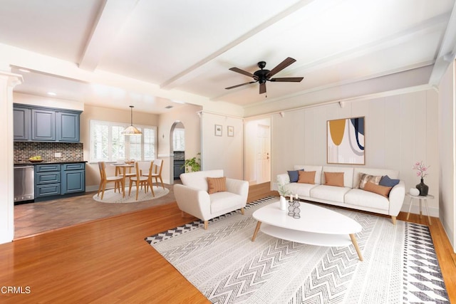 4402 El Camino Corto Ln, Canada Flintridge, CA 91011 - living area with wood finished floors, ceiling fan, beam ceiling, and arched walkways