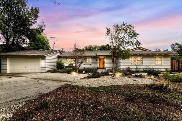 4402 El Camino Corto Ln, Canada Flintridge, CA 91011 - ranch-style home with driveway, an attached garage, and fence