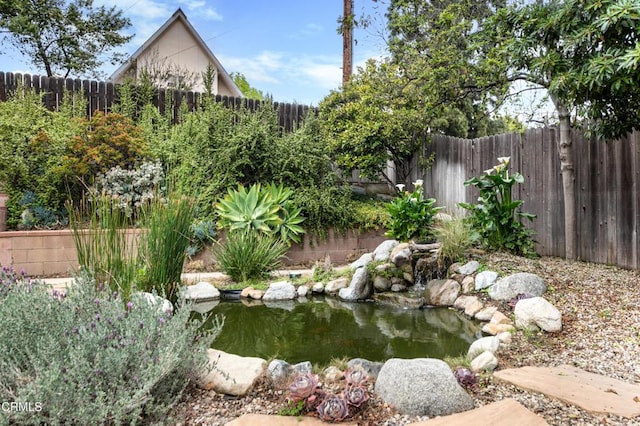 4402 El Camino Corto Ln, Canada Flintridge, CA 91011 - fenced backyard with a garden pond