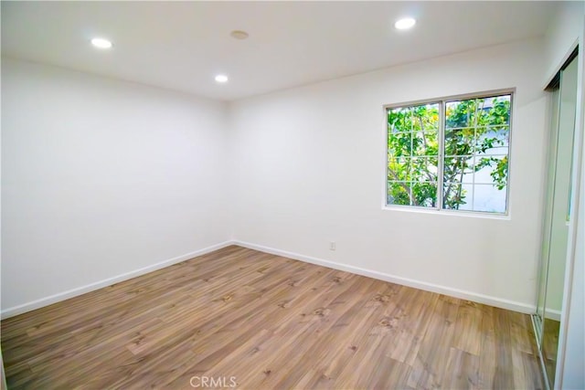 6927 Lindley Ave, Reseda, CA 91335 - empty room featuring wood finished floors, recessed lighting, and baseboards