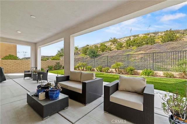 view of patio featuring a fenced backyard and outdoor lounge area
