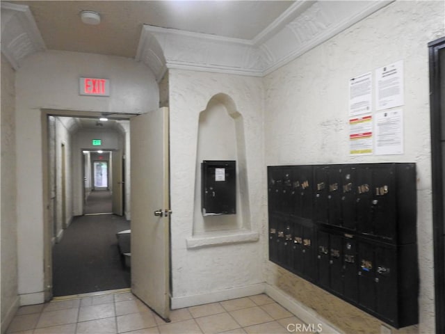 5617 La Mirada Ave, Los Angeles, CA 90038 - hall featuring baseboards, tile patterned flooring, and mail area