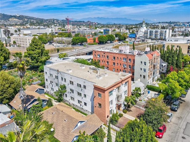 5617 La Mirada Ave, Los Angeles, CA 90038 - drone / aerial view featuring a mountain view
