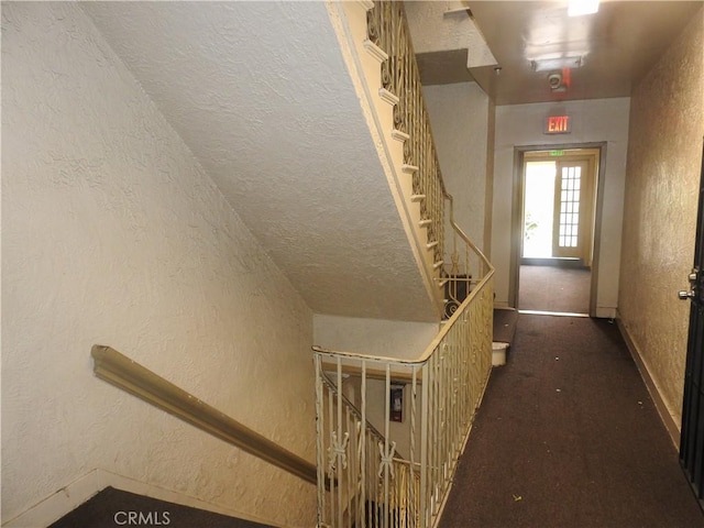 5617 La Mirada Ave, Los Angeles, CA 90038 - stairway featuring baseboards and a textured wall