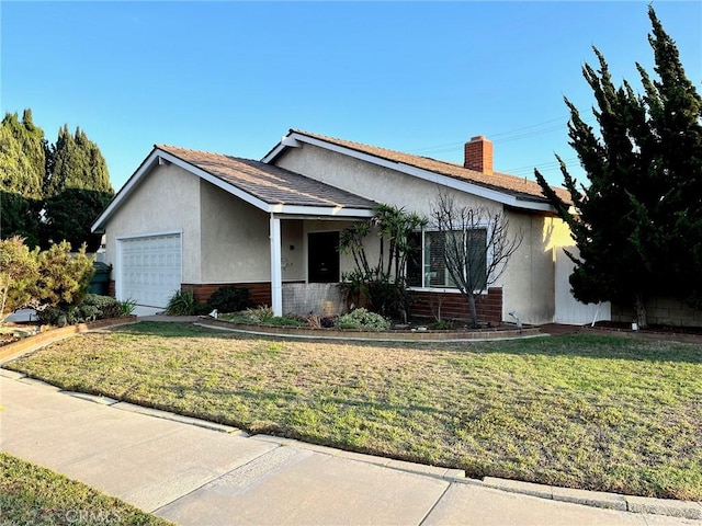 ranch-style house with an attached garage, brick siding, stucco siding, and a front yard