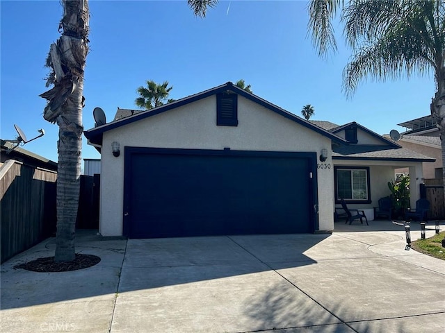 6030 Lea Ct, Winton, CA 95388 - ranch-style house with stucco siding, driveway, fence, and an attached garage
