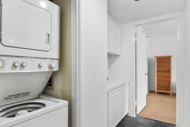 230 W Laurel St Unit 506, San Diego, CA 92101 - laundry room featuring stacked washer / dryer and dark colored carpet