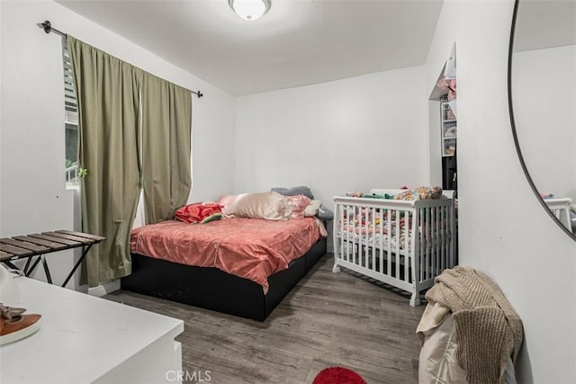 bedroom with wood finished floors
