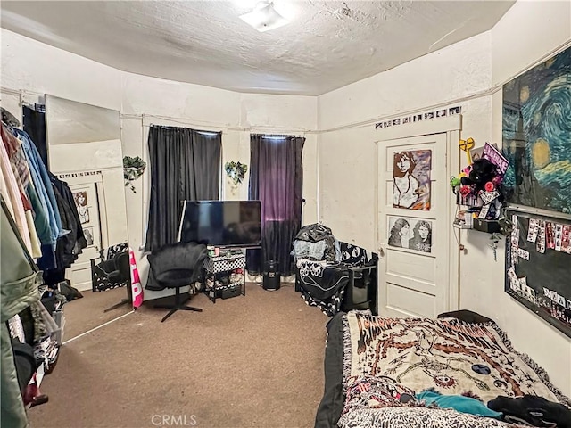 carpeted bedroom with a textured ceiling