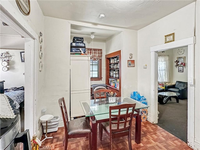 dining room with baseboards