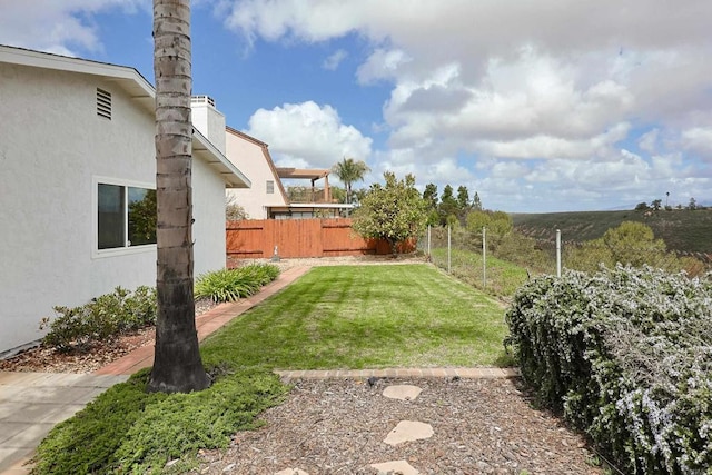 view of yard featuring fence
