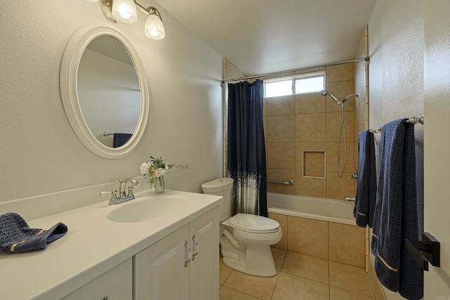 full bathroom featuring tiled shower / bath combo, tile patterned floors, vanity, and toilet