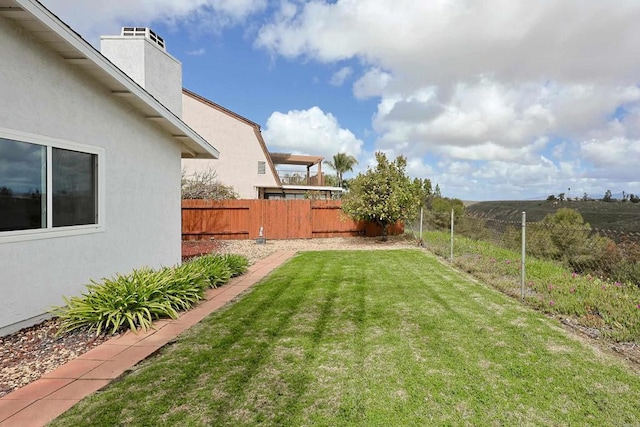 view of yard with a fenced backyard