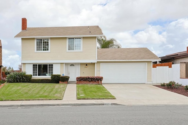 view of front facade with a chimney, fence, a front lawn, concrete driveway, and a garage