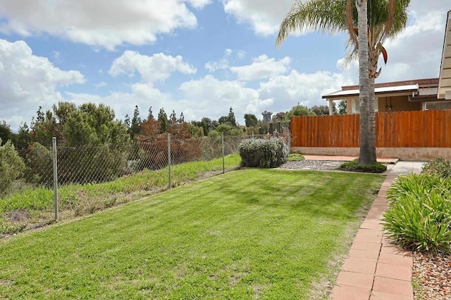 view of yard featuring fence