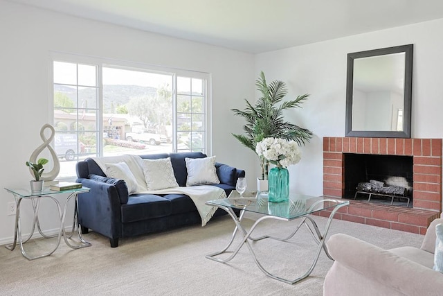 living room featuring a brick fireplace and carpet floors