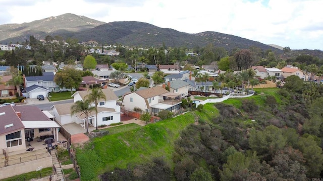 birds eye view of property with a mountain view and a residential view