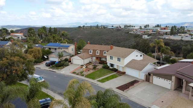 bird's eye view with a residential view and a mountain view