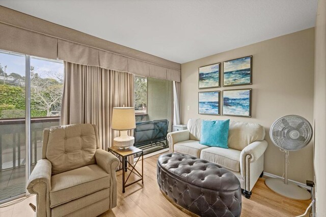 1562 Camino Del Mar Unit 643, Del Mar, CA 92014 - sitting room featuring plenty of natural light and light wood finished floors