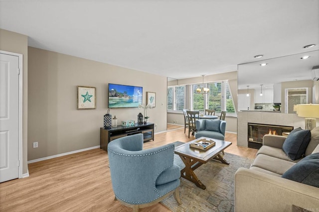 1562 Camino Del Mar Unit 643, Del Mar, CA 92014 - living room featuring light wood finished floors, baseboards, a chandelier, and recessed lighting