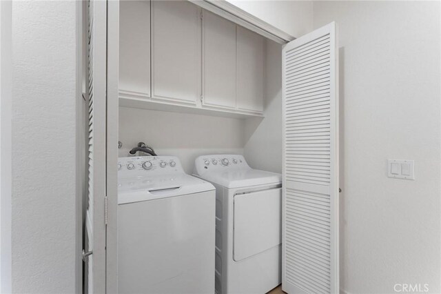 581 Springbrook N, Irvine, CA 92614 - washroom with cabinet space and washing machine and dryer