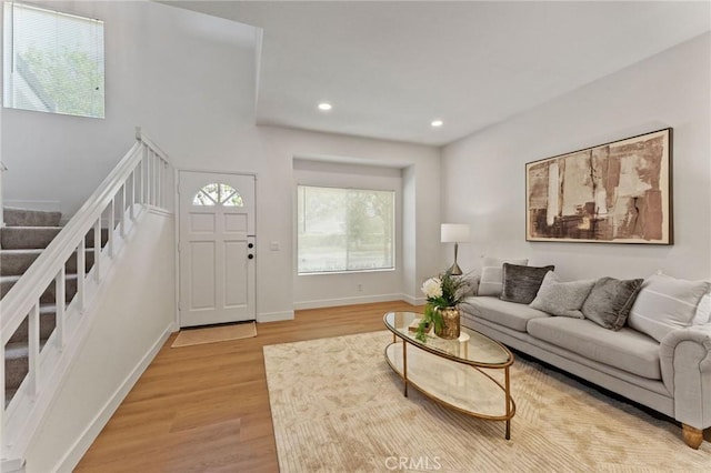 581 Springbrook N, Irvine, CA 92614 - living area with light wood-style floors, recessed lighting, baseboards, and stairs