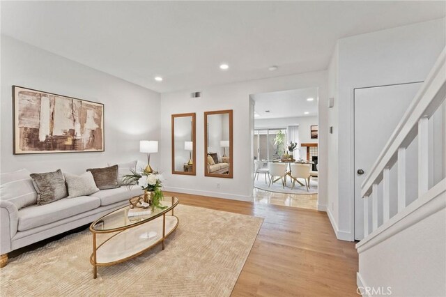 581 Springbrook N, Irvine, CA 92614 - living area featuring recessed lighting, visible vents, light wood-type flooring, and baseboards