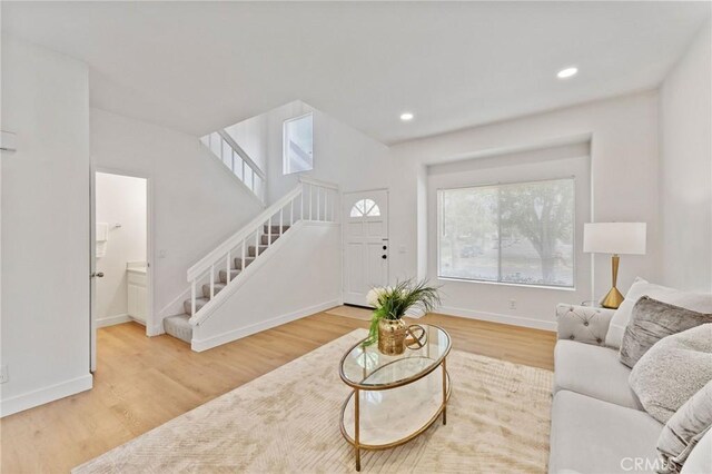 581 Springbrook N, Irvine, CA 92614 - living area featuring recessed lighting, stairway, baseboards, and wood finished floors