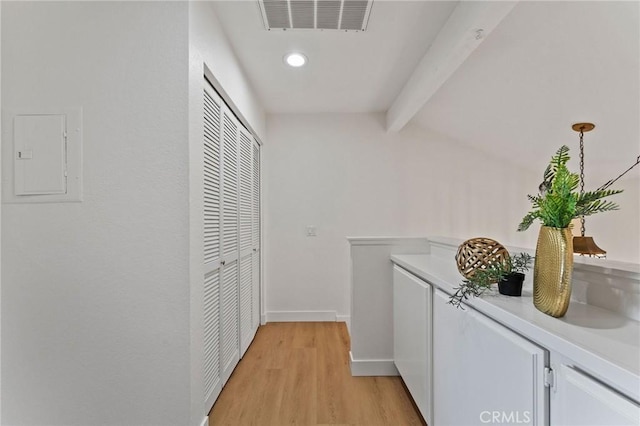 581 Springbrook N, Irvine, CA 92614 - hall with lofted ceiling with beams, electric panel, visible vents, light wood finished floors, and baseboards