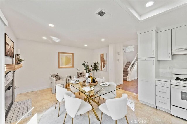 581 Springbrook N, Irvine, CA 92614 - dining area with recessed lighting, stairs, visible vents, and baseboards