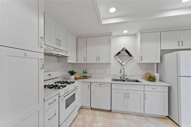 581 Springbrook N, Irvine, CA 92614 - kitchen featuring a sink, light countertops, white appliances, under cabinet range hood, and white cabinetry