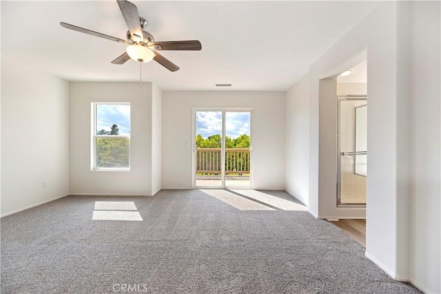 1984 Bronte Rd, San Jacinto, CA 92583 - unfurnished room featuring carpet flooring, ceiling fan, and a wealth of natural light